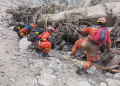 China steps up rescue efforts after massive mudslide strikes border port in Xizang